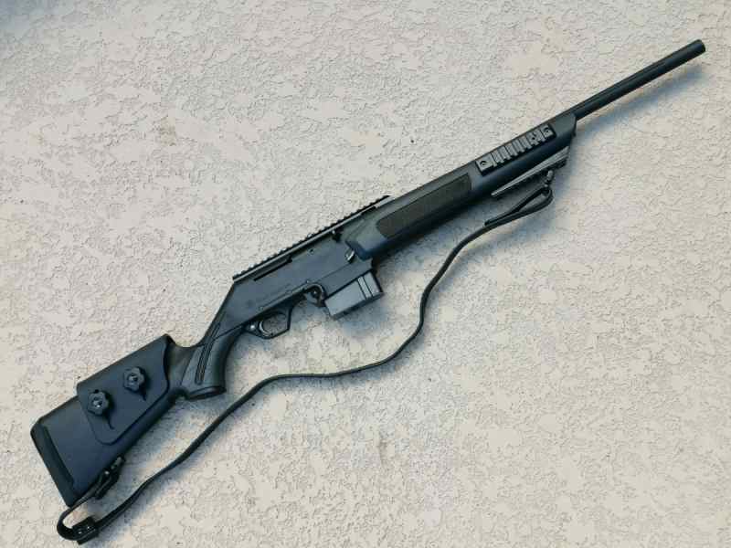 Custom FN FNAR 308 rifle with a sling